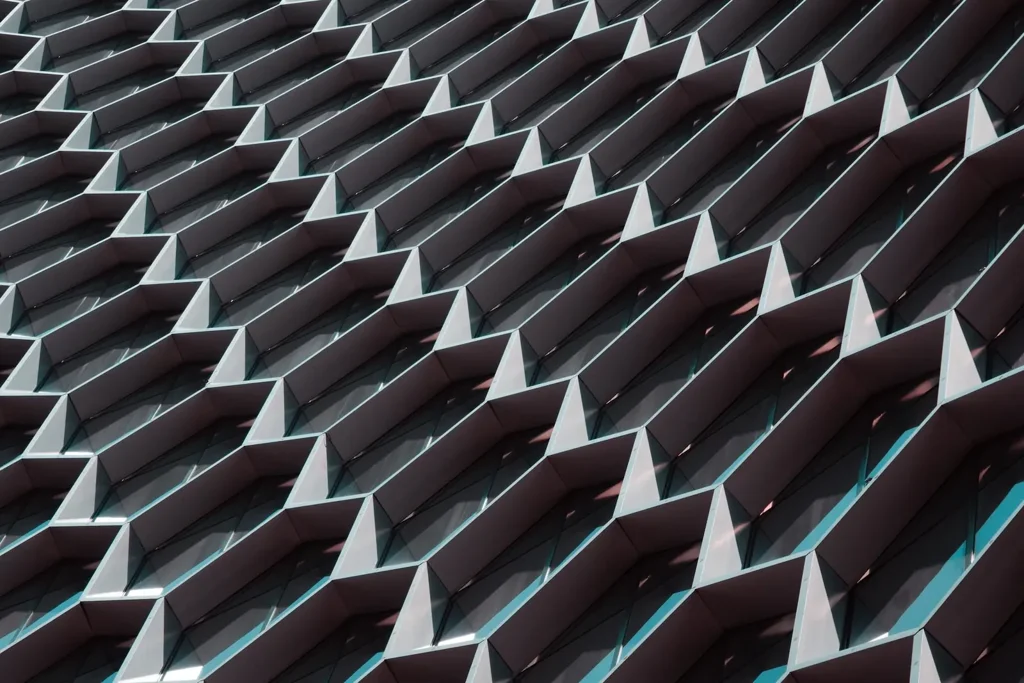 Repeating angular panels across a modern building facade