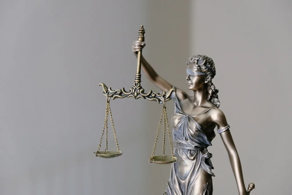 Bronze figure of Justice, blindfolded, holding balanced scales